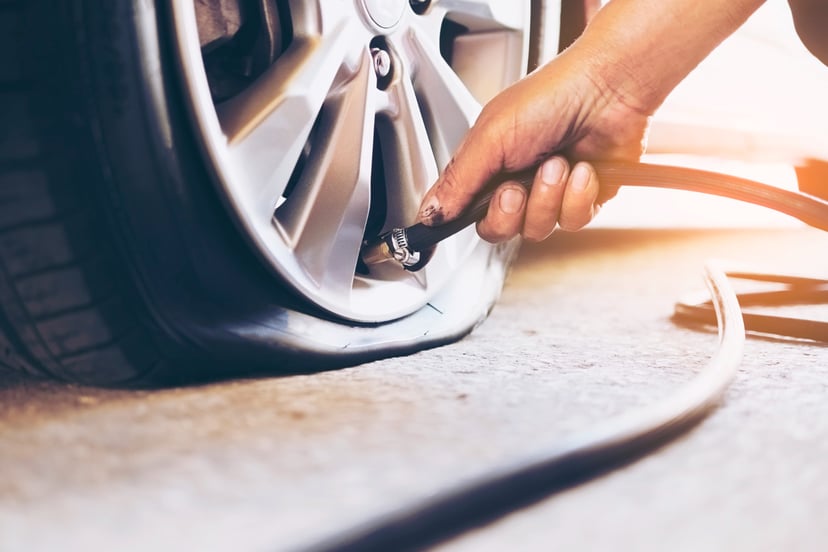 Editors%2 Fimages%2 F1648458226206 Technician Is Repairing Car Flat Tire