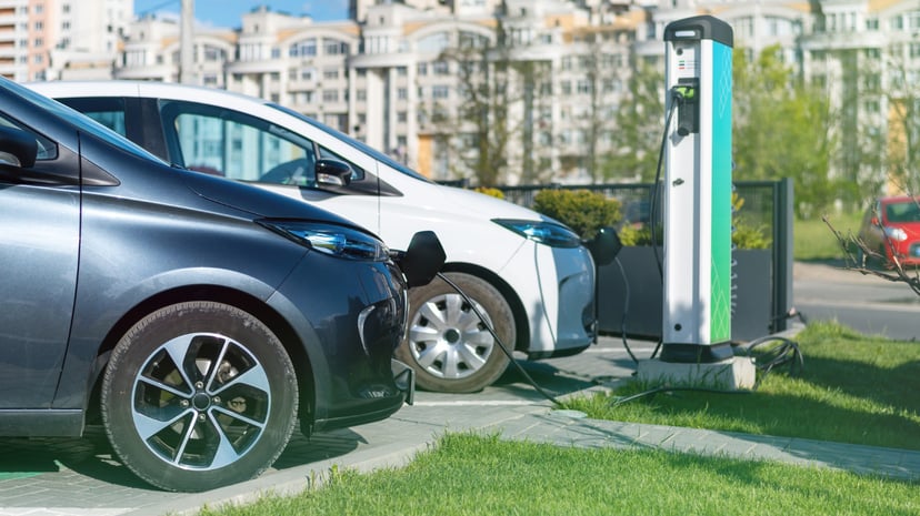 Two Charging Electric Cars Charge Station City