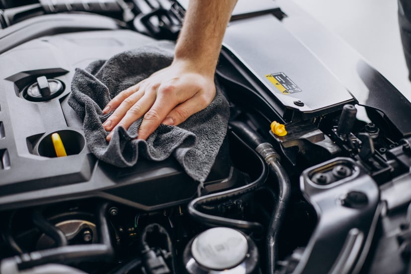 Man Polishing Car Inside Car Service