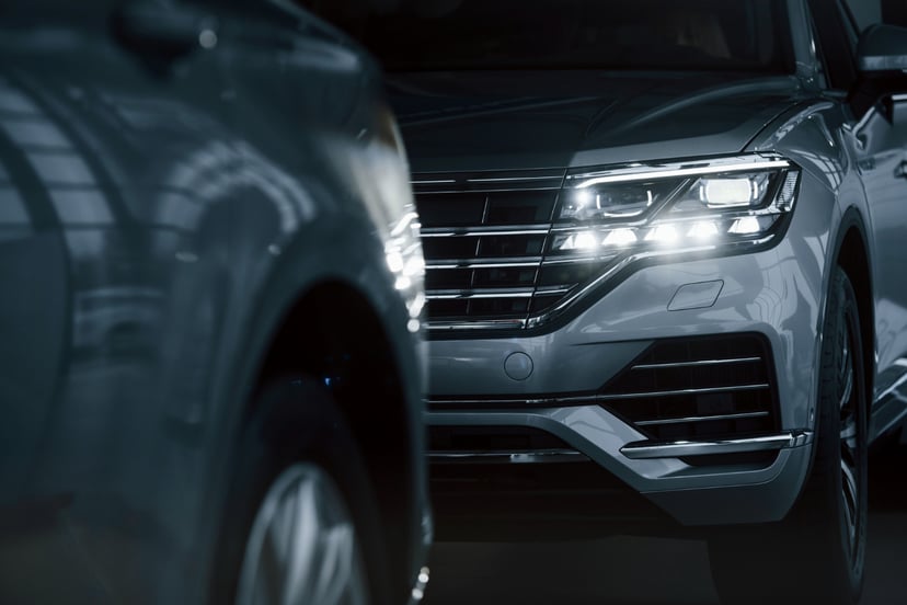 Powerful Headlights Particle View Modern Luxury Cars Parked Indoors Daytime