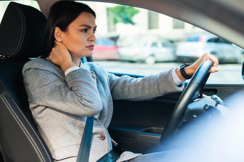Editors%2 Fimages%2 F1657011441858 Side View Businesswoman Having Neck Pain Car