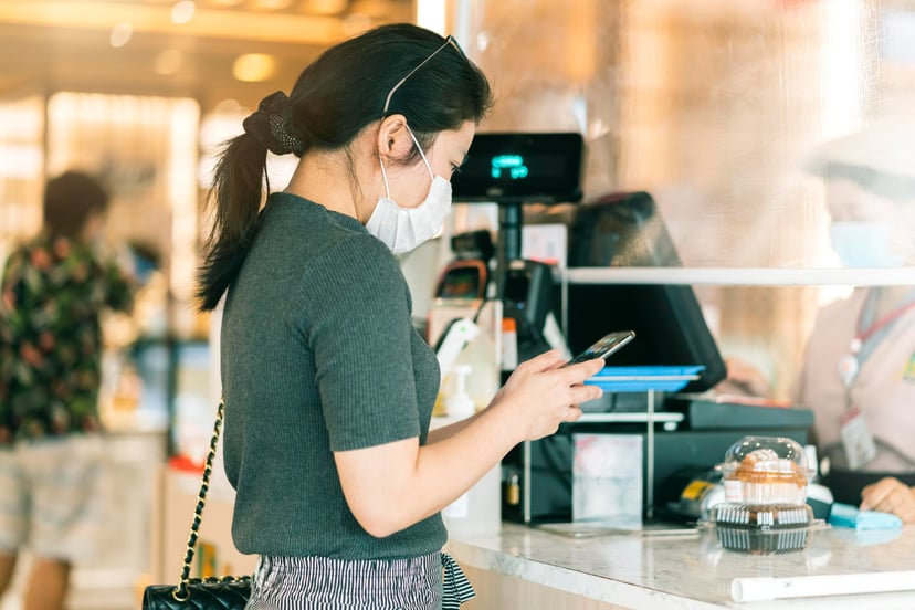 Editors%2 Fimages%2 F1664435630968 New Normal After Covid Epidemic Asian Female Payment Progress Buy Scaning App By Smarthine Cashless Touchless New Lifestyle Shopping Department Store Cashier Counter