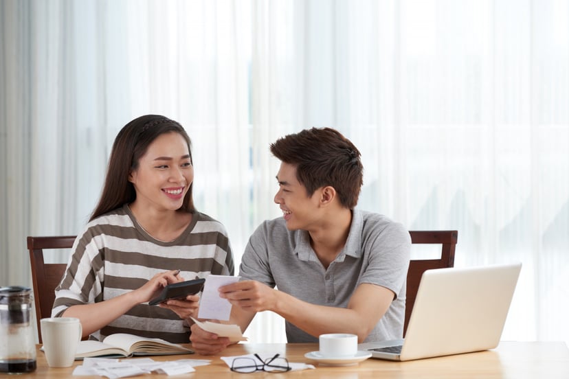 Young Couple Managing Family Budget Home