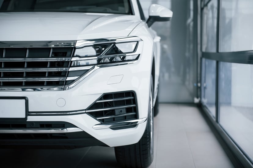 Editors%2 Fimages%2 F1696330479752 Particle View Modern Luxury White Car Parked Indoors Daytime