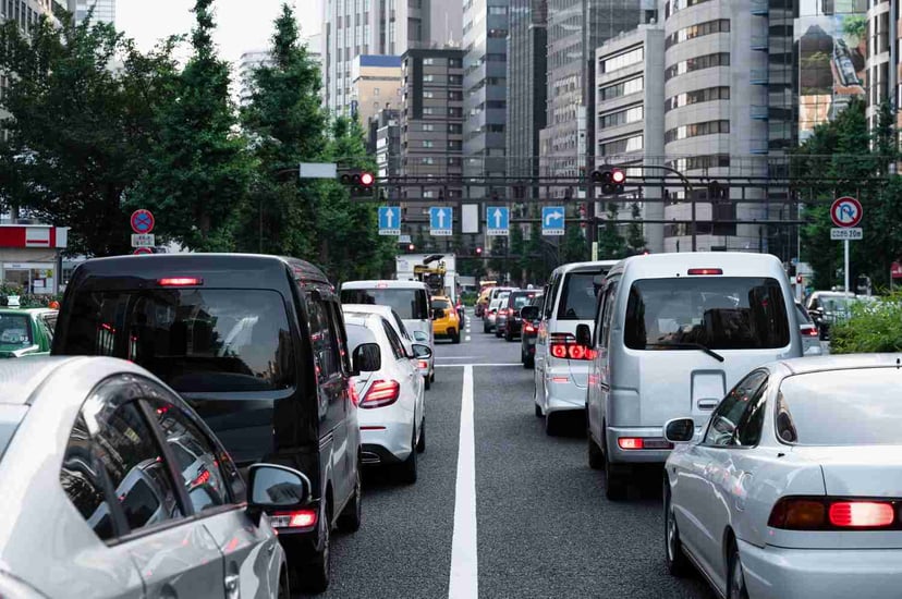 Editors%2 Fimages%2 F1699516149640 People Driving Cars City Street+%281%29
