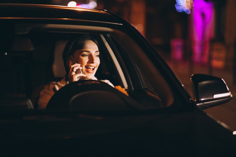 Young Woman Driving Car Night