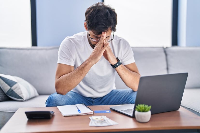 Young Hispanic Man Stressed Using Laptop Working Home 1671