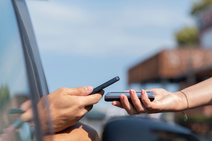 Customer Paying With His Phone Curbside Pickup