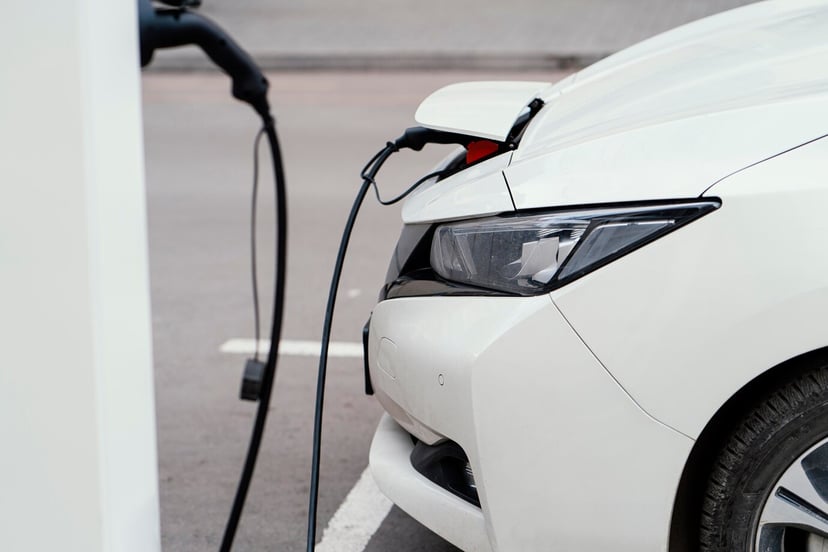 Side View Automobile Being Charged Electric Vehicle Charging Station