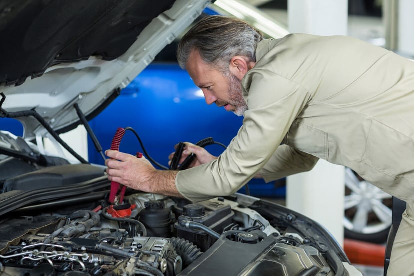 Editors%2 Fimages%2 F1741935891943 Mechanic Attaching Jumper Cables Car Battery 1170 1134