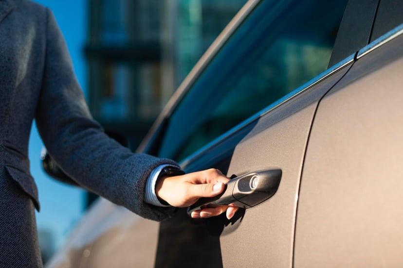 Editors%2 Fimages%2 F1742283519039 Businesswoman Opening Her Car Door 23 2148767027