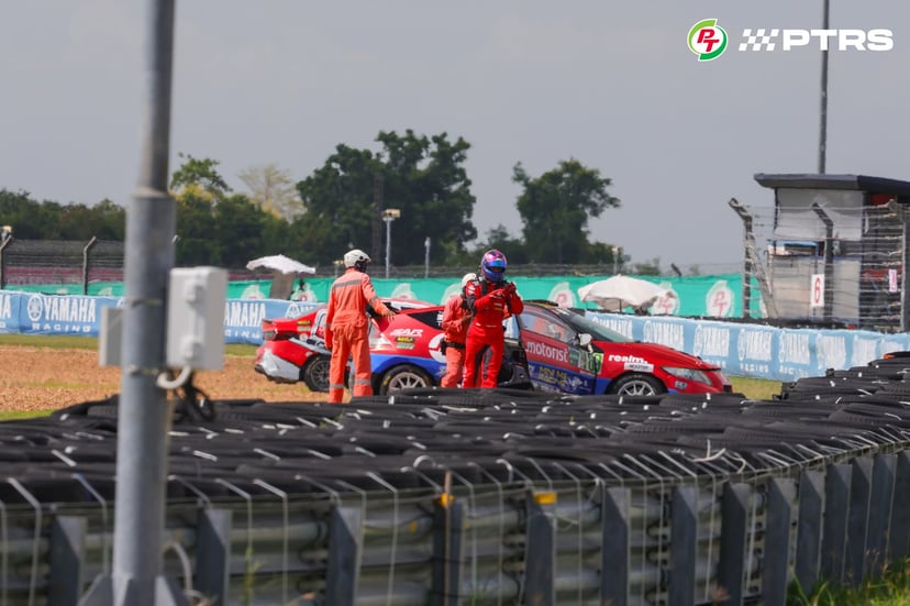 Aiden leaving his stranded car after a mechanical issue caused him to make an early exit from the race.